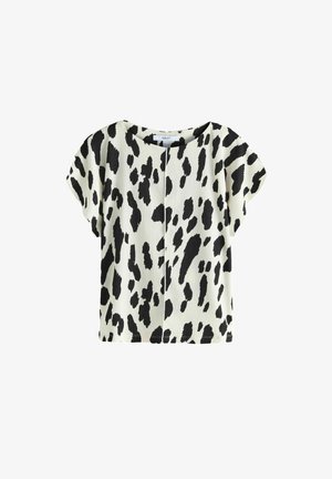 Lühikeste varrukatega tipp kreemivärvi kangast, millel on must loomade trikoo. Omab ümmargust kaelust ja lõdva istuvust, keskel on õmbluse detail.