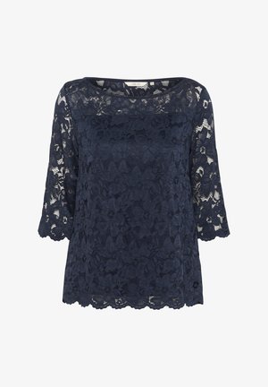 Top in pizzo blu navy con maniche a tre quarti, design floreale e orlo scallop. Tessuto leggero con finitura texturizzata.