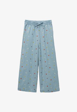Pantalons en denim bleu clair à jambes larges, ornés de broderies florales multicolores et dotés d'une taille élastique avec cordon de serrage.