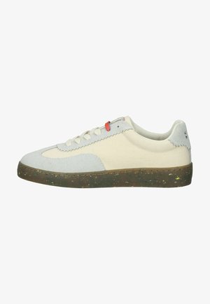Sneaker with a light blue suede upper and cream canvas body, featuring a speckled brown rubber sole and white laces. Red accent on tongue.
