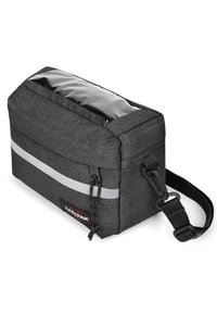 Borsa in tessuto nero e texturizzato con un pannello superiore trasparente, striscia riflettente argento, tracolla regolabile e tasca frontale con zip. Presenta il logo del marchio.