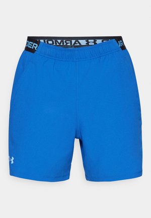 Blue athletic shorts made of soft fabric. Features an elastic waistband with black Under Armour logo and side pockets. Smooth texture.