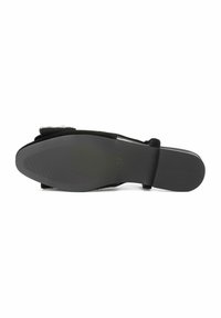 Sole of black women's flat shoe with textured grip, square heel, and embellishment on upper strap, size 37 marked on sole.