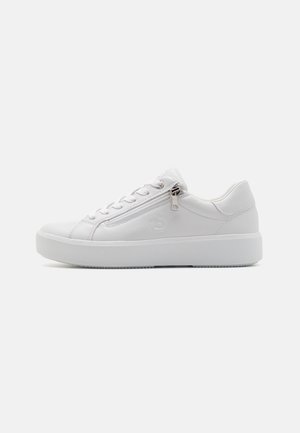 White synthetic sneakers with a low-top design, round toe, lace-up front, and a side zip. Textured rubber sole and subtle logo detail.