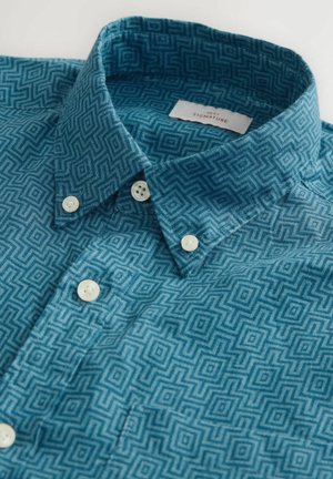 Turquoise patterned shirt with a geometric design, featuring a button-down collar and white buttons, made from a textured fabric.