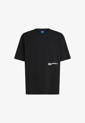Mustalane puuvillane T-särk lühikeste varrukatega, ümar kaelus ja valge "Karl Lagerfeld Jeans" logo vasakul rinnal. Sile tekstuur.