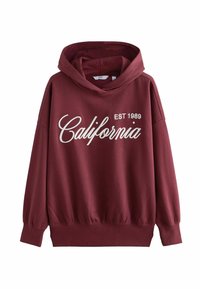 Bordeauxrode hoodie met een grote "California"-opdruk en "EST 1989." Gemaakt van een zachte stof met een ontspannen pasvorm en geribbelde manchetten.