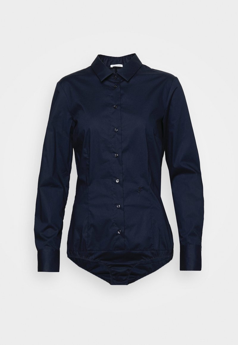 Navy blue button-up shirt with a collar, long sleeves, and a tapered design. Made of smooth cotton with a tucked bottom for a fitted look.