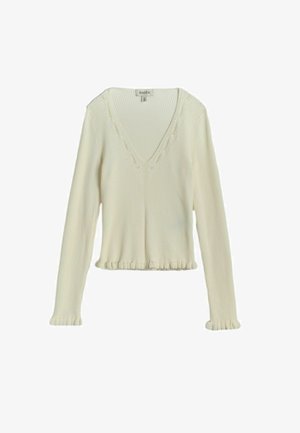 Krēmkrāsas ribota auduma garroku tops ar V veida izgriezumu un smalkām volānu detaļām uz aprocēm un apakšmalu.