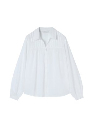 Cămașă albă cu mâneci lungi și nasturi, guler cu guler, detalii pliate pe piept și manșete elastice. Fabricată dintr-un material ușor.