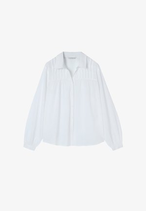 Valkoinen pitkähihaisten nappipaitojen, joissa on kauluksellinen kaulus, rypistyksiä rinnassa ja joustavat hihansuut. Valmistettu kevyestä kankaasta.