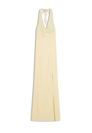 Long pale yellow halter-neck dress with deep V-neck, gathered bust detail, and thigh-high slit on the left side.