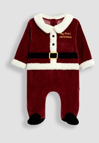 Tutina per neonati in velluto rosso con colletto in morbido pile bianco, bottoni e la scritta "il mio primo Natale". Design con cintura nera e piedi.