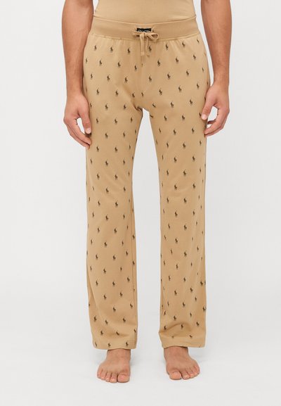 Pantaloni jogger beige da uomo con vita regolabile con cordoncino, tessuto morbido e motivo a logo polo nero su tutto il capo.