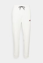 HUGO DROKKO - Tracksuit bottoms - light pastel green/white - Zalando.de