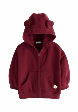 Haut de hoodie zippé bourgogne en tissu doux, avec une capuche ornée d'oreilles d'ours, des poches avant et des poignets et un ourlet côtelés.