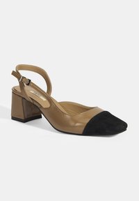 Brown synthetic slingback shoe with square toe, black suede cap, and a block heel. Features adjustable strap and textured material.