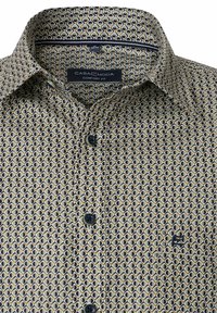 Short-sleeve shirt in a geometric pattern of beige, navy blue, and gold. Fabric features a smooth texture, with black buttons and a small logo.