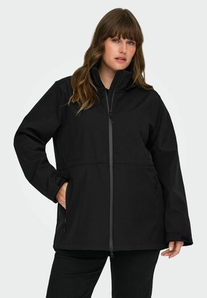 Giacca nera impermeabile con colletto alto, zip frontale e tasche laterali. Presenta una vestibilità rilassata e un tessuto liscio e strutturato.