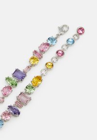 Multicolored gemstone bracelet with oval and rectangular stones in shades of pink, green, blue, yellow, and purple, set in silver-tone hardware.