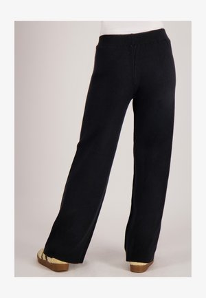 Zwarte broek met wijde pijpen en een rekbare tailleband, met een gladde textuur en een rechte snit, gezien van de achterkant.