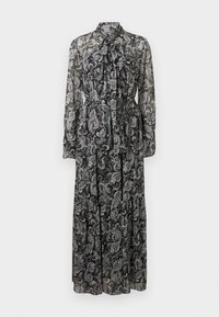 Διάφανο μαύρο μάξι φόρεμα με άσπρο σχέδιο paisley, μακριά μανίκια, ψηλό γιακά και κορδόνι που δένει στο λαιμό, με μαζεμένη μέση.