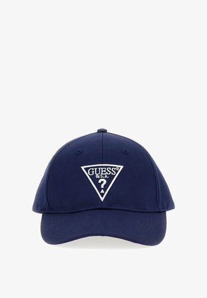 Navy blue baseball cap with white embroidered GUESS USA triangle logo and question mark on front center.