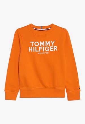 Sweatshirt à col rond à manches longues orange avec "Tommy Hilfiger New York, 1985" imprimé en blanc sur le devant, poignets et ourlet côtelés.