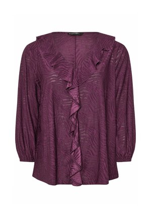 Purppura blouse, jossa on teksturoitu, aaltoileva kuvio. Varustettu röyhelökauluksella ja pitkillä, puffattujen hihoilla. Kevyt, virtaava kangas.