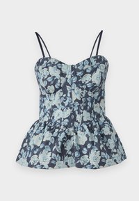 Tumes olev floral peplum ülenev, millel on helesinised lilled. Kitsa kehaosaga, reguleeritavate rihmadega ja laieneva volangäärisega. Sile kangasteksts.