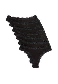 Schwarze String-Tanga mit Spitzenbesatz und geschichteter Wellenmusterung, verziert mit dekorativen Schleifen vorne und strukturiertem Stoff für zusätzlichen Komfort.