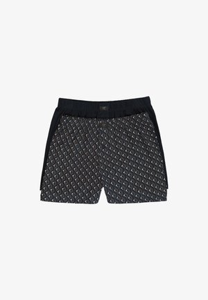 Badehosen aus einem navyfarbenen, gemusterten Stoff mit geometrischen Designs, elastischem Bund und einfarbigen schwarzen seitlichen Akzenten.