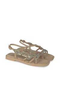 Beige flache Sandalen zeichnen sich durch ein Riemen-Design aus, das mit mehrfarbigen Strasssteinen auf dem Obermaterial verziert ist. Weicher, samtähnlicher Stoff und verstellbarer Knöchelriemen.