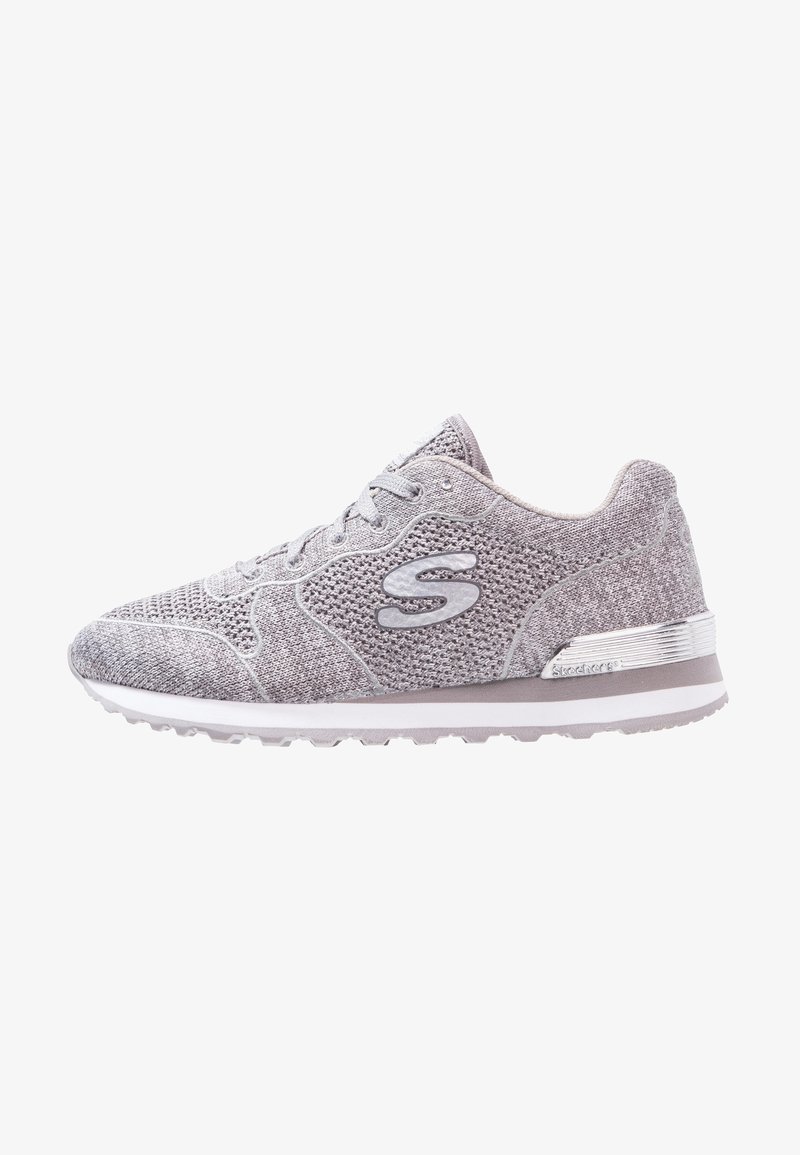 Light gray athletic shoe with a textured knit upper, lace-up design, padded collar, and silver accent on the heel. Rubber sole for traction.
