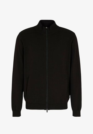 Veste noire à fermeture éclair avec un col montant, des poignets et un ourlet côtelés ; fabriquée en tissu tricoté lisse ; dotée de deux poches latérales.