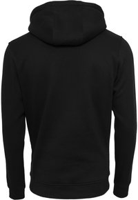 Hoodie noir en tissu doux, avec une capuche arrondie, des manches longues et un design arrière propre et sans couture. Pas de logos ou motifs visibles.