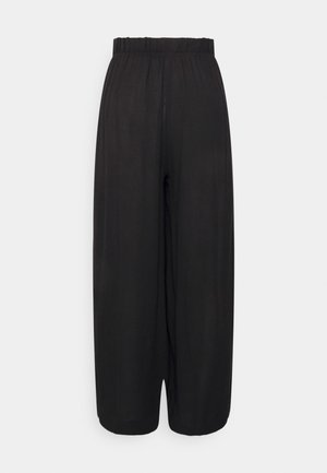 Black, loose-fitting culotte pants with an elastic waistband. Made of a lightweight fabric, featuring a smooth texture and no visible patterns.