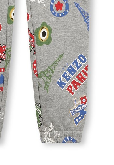 Pantalons de survêtement en coton gris avec des graphismes multicolores de la Tour Eiffel, de fleurs et de texte. Taille élastique et coupe ajustée.