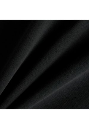 Black fabric with fine weave folded diagonally, showing soft texture and subtle lighting highlights.