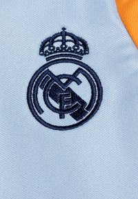 adidas Performance REAL MADRID 24/25 TRACK SUIT YOUTH UNISEX SET - Club wear - glow blue/crew orange/team navy blue 2