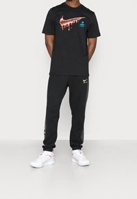 Nike Sportswear Träningsbyxor - black