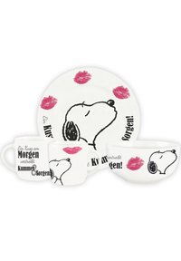 Ceramic dishware set featuring a bowl, two mugs, and a plate. Each piece is white with black dog illustrations and red lipstick prints.
