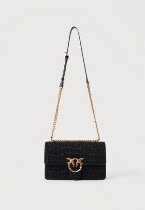 Black textured shoulder bag with gold chain strap and a gold clasp featuring two birds on a ring detail.