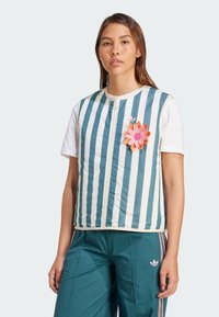 Striped vest in teal and white fabric with a zipper front, featuring a floral appliqué in pink and orange on the left side.