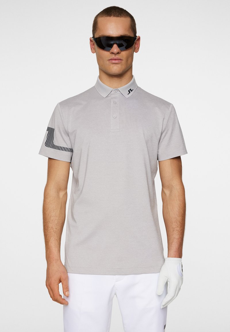 Light gray polo shirt with short sleeves, a collared neck, three buttons, and black striped pattern detail on the left sleeve.