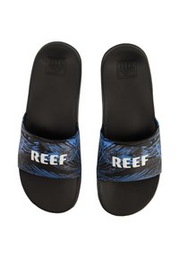 Black slide sandals with a textured sole; patterned blue strap featuring "REEF" logo in white. Lightweight, designed for casual wear.