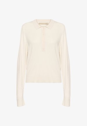 Tejfehér, hosszúujjú pólóing, puha kötött anyagból készült, bordázott gallérral, négy gombos záródással és laza szabással. Sima tapintású.