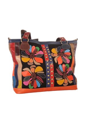 Colorful leather tote bag with flower patterns, brass studs, double handles, and multicolored patchwork details on a black background.
