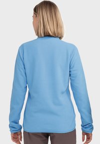 Langarm-Fleece-Oberteil in Hellblau mit weicher Textur, mit Stehkragen und schmal zulaufenden Ärmeln an den Handgelenken.