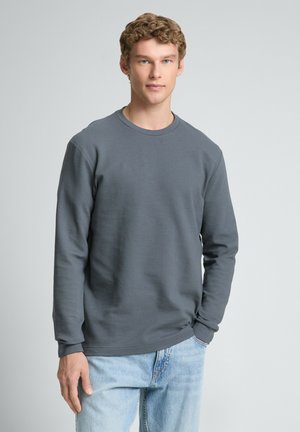 - Bluzka z długim rękawem